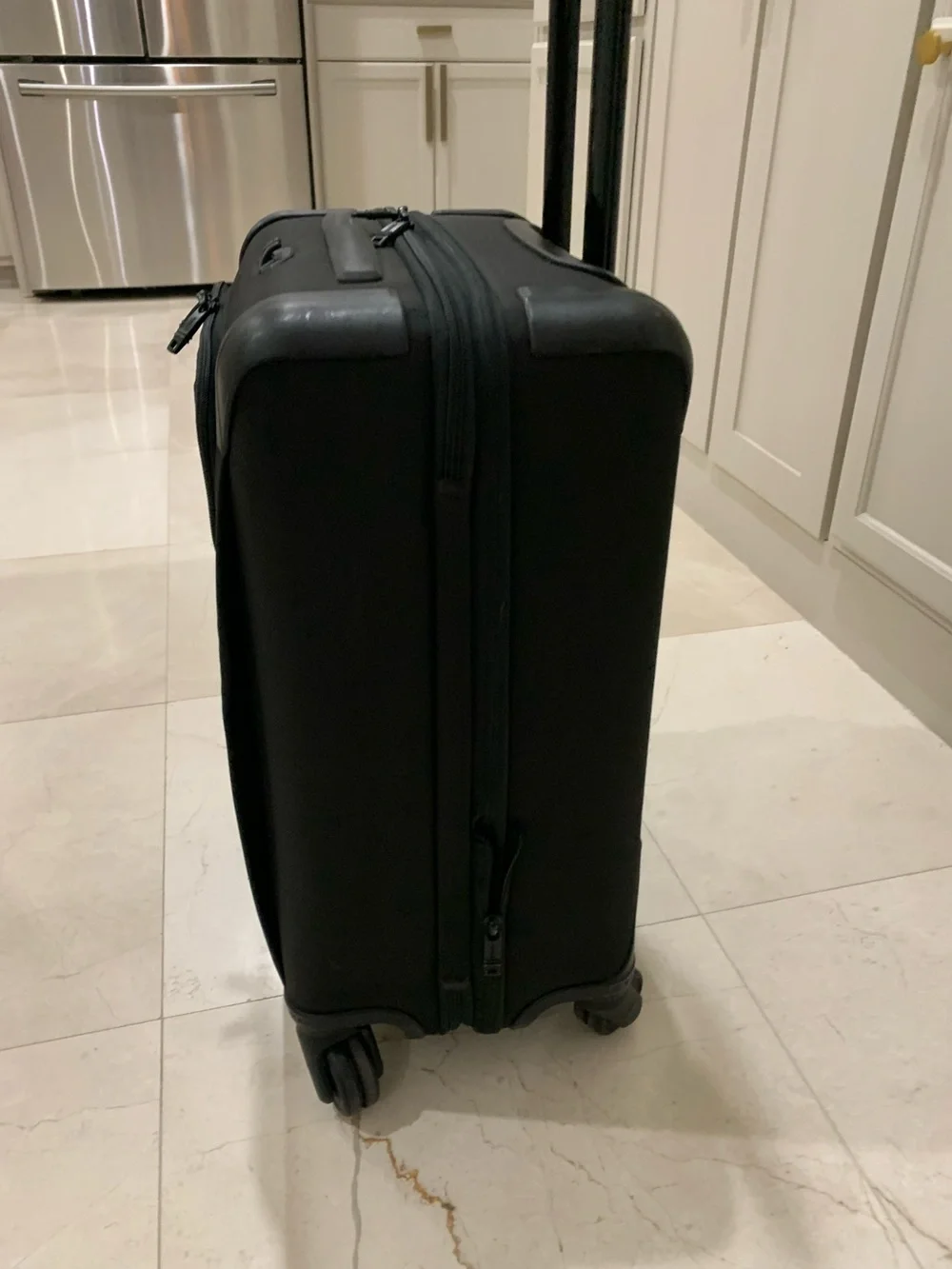 Tumi Black Spinner Carry-On with Front Zip Pocket luggage